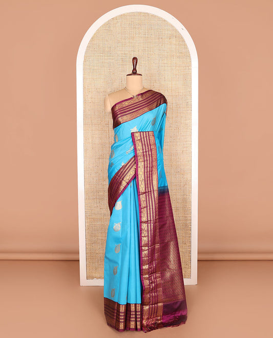 Blue zari buttas budget silk saree, contrast traditional zari design border, and pallu of jaal design