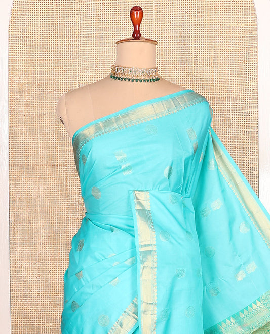 Sky blue peacock chakram motifs budget silk saree, traditional zari border, and contrast ogee patterned pallu