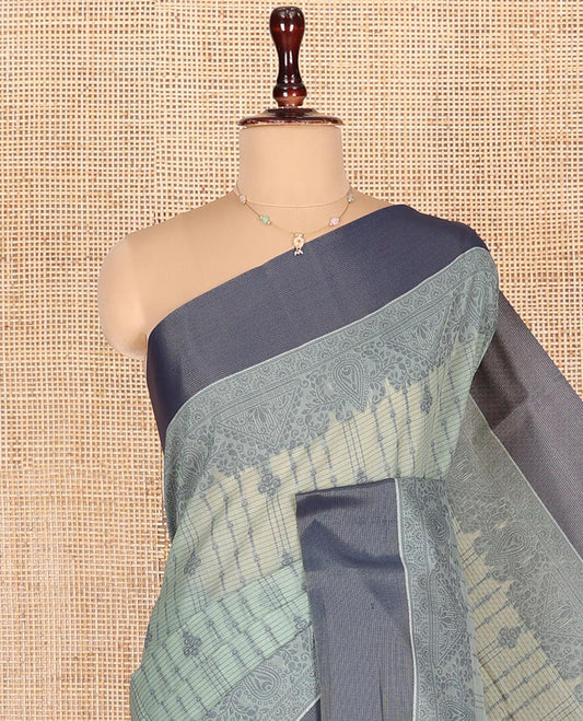 Pastel Blue Semi-Silk Cotton Saree, Sparsely Woven with Buttas and Geometric Designs All Over Its Body, Complemented by Contrast Border, Sparsely Woven Pallu of Geometric Designs, and Paired with a Matching Blouse