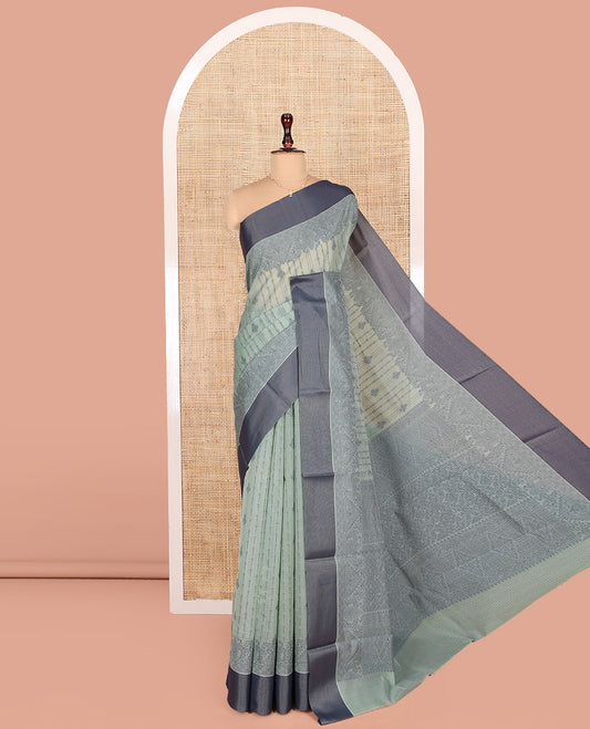 Pastel Blue Semi-Silk Cotton Saree, Sparsely Woven with Buttas and Geometric Designs All Over Its Body, Complemented by Contrast Border, Sparsely Woven Pallu of Geometric Designs, and Paired with a Matching Blouse