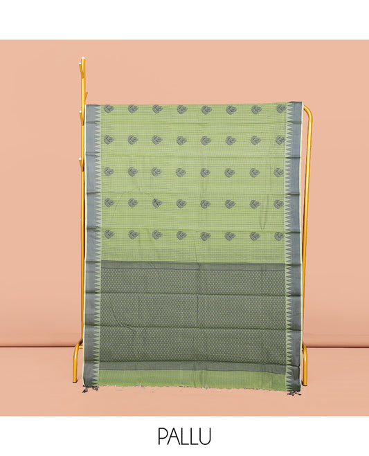 Green Semi-Silk Cotton Saree, Subtly Sparkled with Buttas and Micro-Checks All Over Its Body, Highlighted by a Temple Border, Intricate Pallu, and Paired with a Contrast Blouse