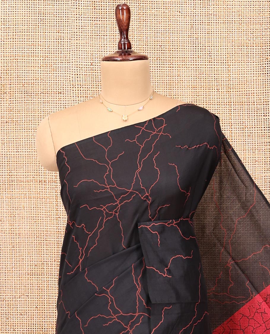 Borderless Black-Red Poly Cotton Saree, Creatively Printed Like Lightning Strikes, a Contrasting Lightning-Strike-Printed Pallu, and a Contrast Blouse