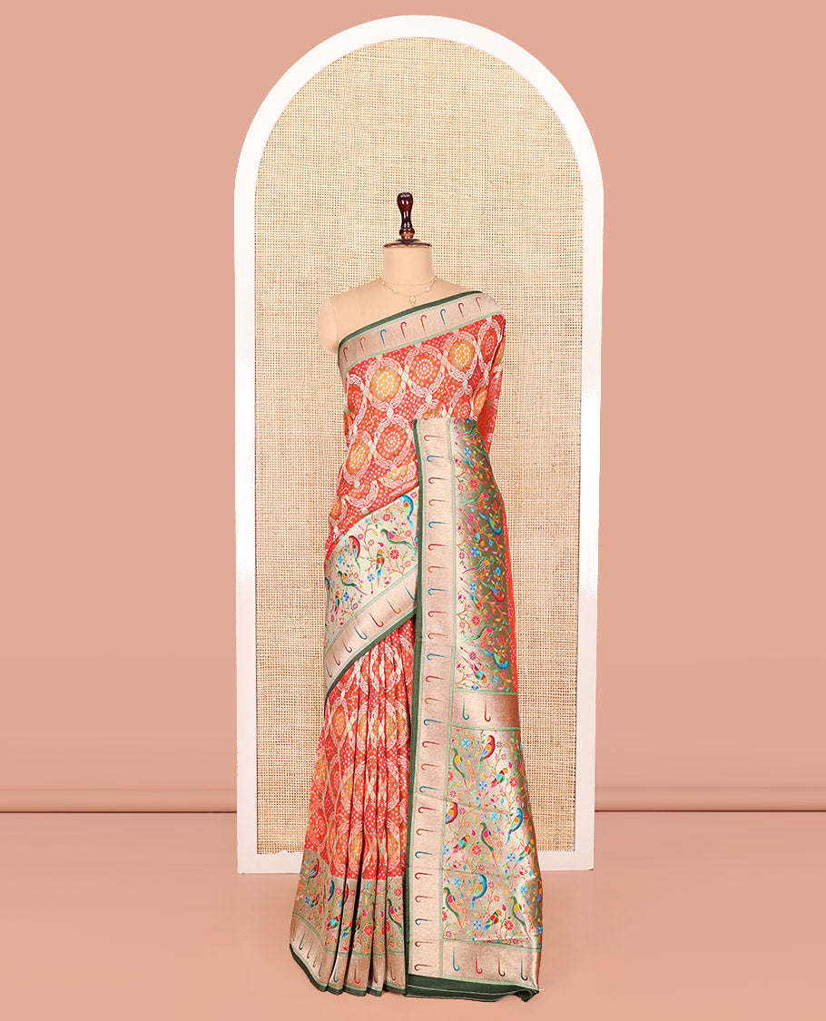 Orange Dola Silk Saree, Beautifully Bedecked with Bandhani Ghar Chola Patterns on Its Body, Complemented by Contrast Muniya Paithani Floral-Peacock Border, Pallu of Muniya Paithani Floral-Peacock Design, and Paired with a Contrast Blouse
