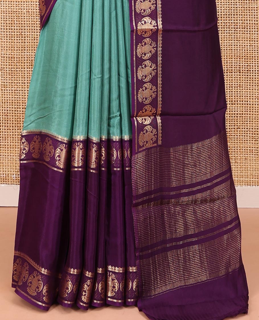 Olive Green Plain Dola Silk Saree, Complemented by Contrast Rettai Pettu Ganda Berunda Motifs, Zari Border, Gleaming Zari Striped Pallu, and Paired with a Contrast Blouse