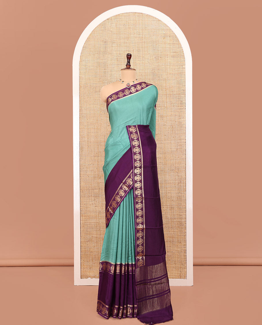 Olive Green Plain Dola Silk Saree, Complemented by Contrast Rettai Pettu Ganda Berunda Motifs, Zari Border, Gleaming Zari Striped Pallu, and Paired with a Contrast Blouse