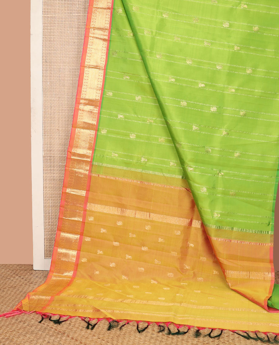 Green mayil buttas and zari stripes Kanchipuram silk saree, contrast one-sided border of laddu kamalam, and mayil kann designs, and zari design pallu