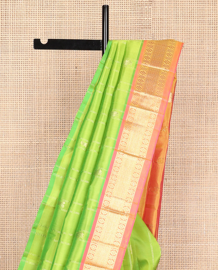 Green mayil buttas and zari stripes Kanchipuram silk saree, contrast one-sided border of laddu kamalam, and mayil kann designs, and zari design pallu