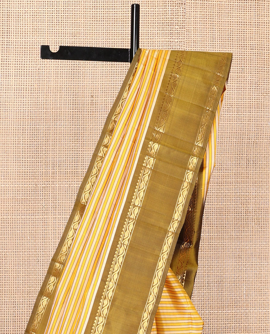 Yellow striped kanchipuram silk saree, contrast rettai pettu border of rekku, muthu & leaf vine & pallu of zari stripes