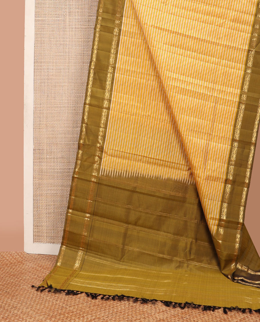 Yellow striped kanchipuram silk saree, contrast rettai pettu border of rekku, muthu & leaf vine & pallu of zari stripes