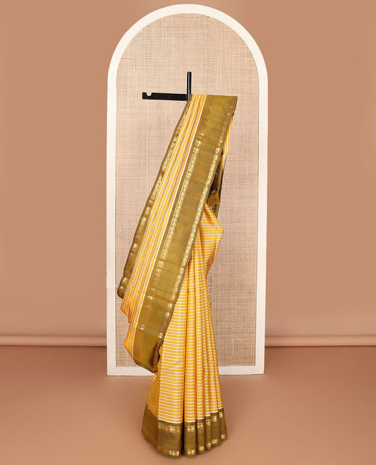 Yellow striped kanchipuram silk saree, contrast rettai pettu border of rekku, muthu & leaf vine & pallu of zari stripes