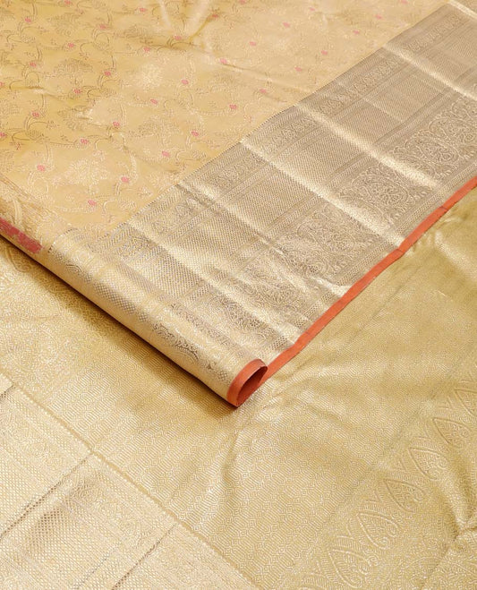 Yellow jacquard Kanchipuram silk saree, zari border of thilakam, kuyil kann, and arumbu manga designs, and geometric patterned pallu