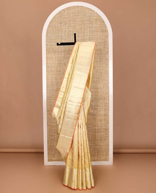 Yellow jacquard Kanchipuram silk saree, zari border of thilakam, kuyil kann, and arumbu manga designs, and geometric patterned pallu