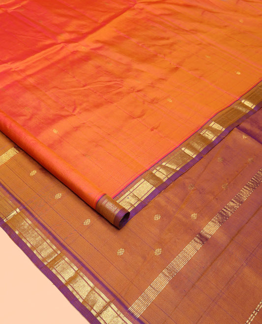 Orange Kanchipuram Silk Saree, Crafted with Zari Buttas All Over Its Body, Complemented by a Contrast One-Sided Border of Banaras, and Mayil Kann Designs, Pallu of Zari Designs, and Comes Without a Blouse