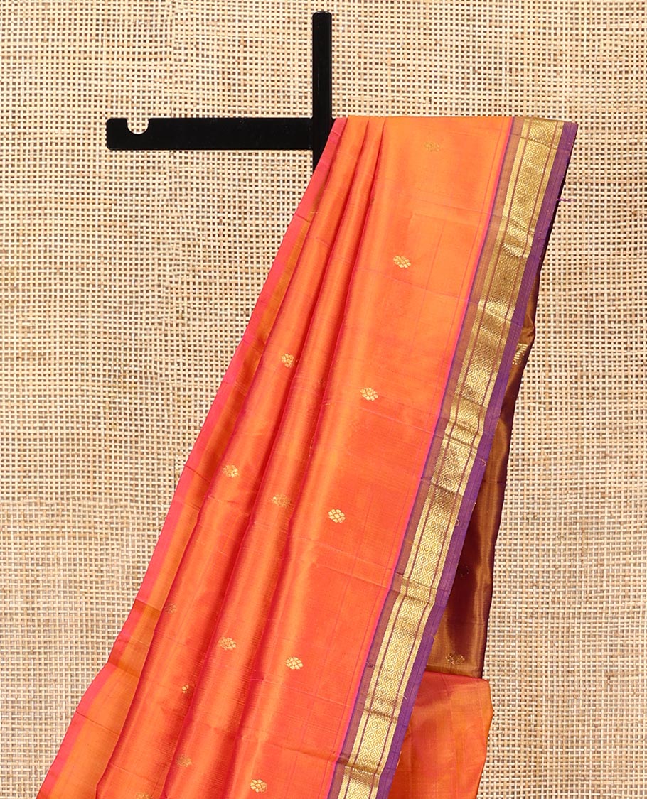 Orange Kanchipuram Silk Saree, Crafted with Zari Buttas All Over Its Body, Complemented by a Contrast One-Sided Border of Banaras, and Mayil Kann Designs, Pallu of Zari Designs, and Comes Without a Blouse