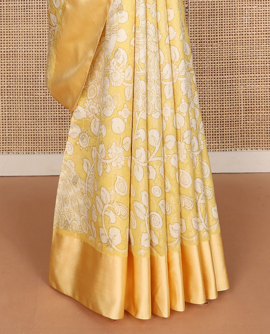 Yellow kalamkari-style floral vine & peacock printed tussar saree with zari buttas, plain border & plain pallu