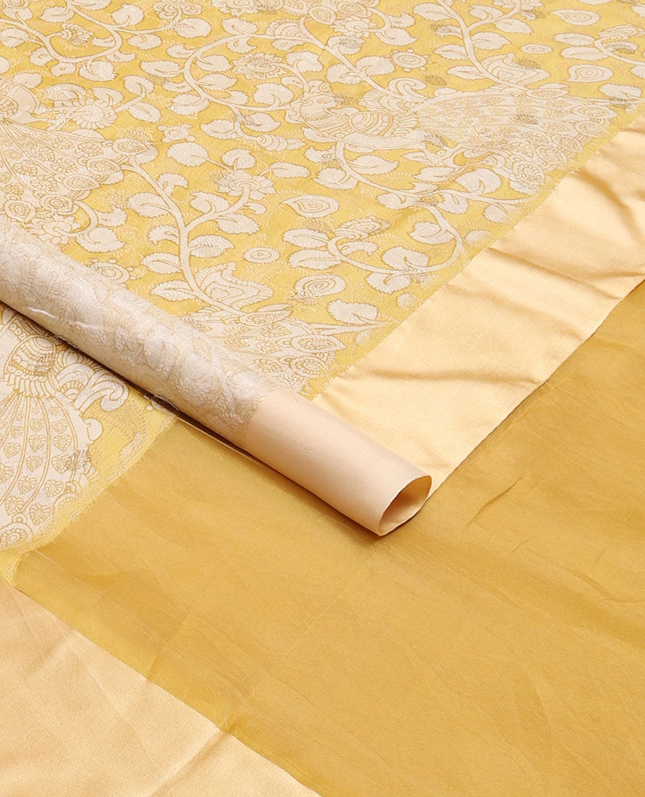 Yellow kalamkari-style floral vine & peacock printed tussar saree with zari buttas, plain border & plain pallu