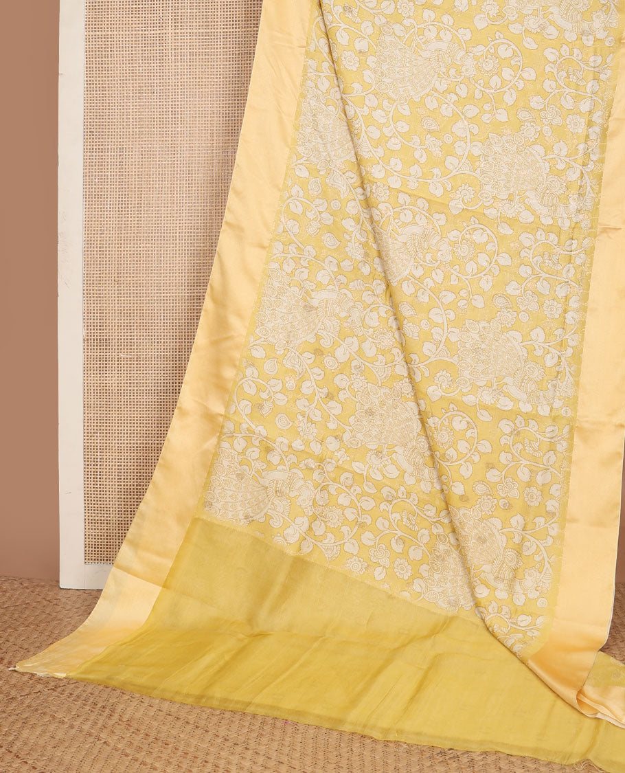 Yellow kalamkari-style floral vine & peacock printed tussar saree with zari buttas, plain border & plain pallu