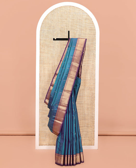 Blue Vasundhara Lite Silk Mix Saree, Sparsely Woven with Zari Buttas All Over Its Body, Complemented by a Contrast Temple Border, Grandly Decked Up Pallu, and Paired with a Contrast Blouse