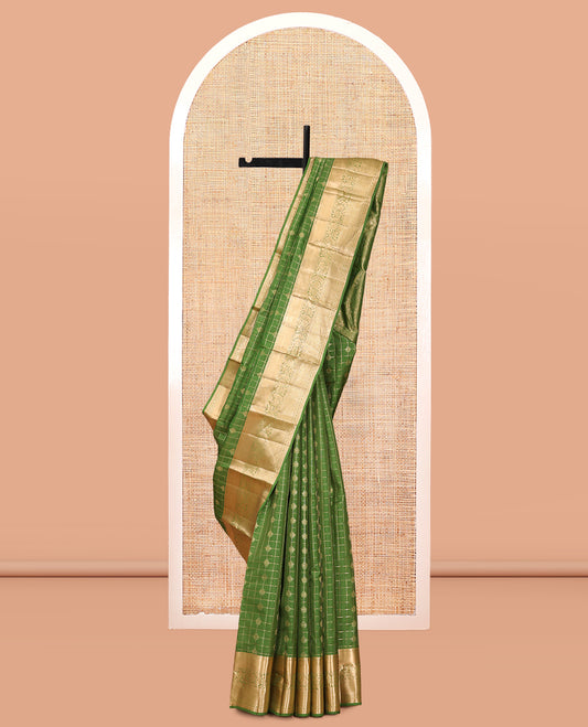 Green Vasundhara Lite Silk Mix Saree, Ornamented with Zari Buttas and Checks, a Zari Border of Thilakam, Kodi Visiry, and Kuyil Kann Designs, Grand Pallu, and a Matching Blouse