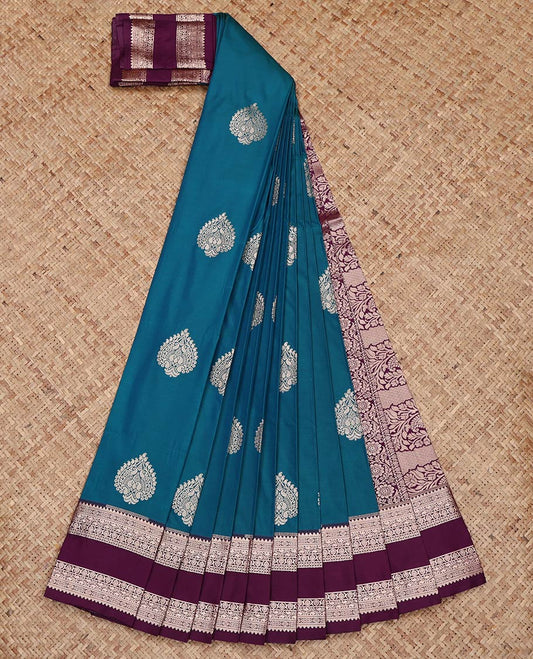 Peacock Color Budget Silk Saree, Bedecked with Zari Buttas on Its Body, Complemented by a Contrast Traditional Zari Design Rettai Pettu Border, Intricately Designed Pallu, and Paired with a Contrast Blouse