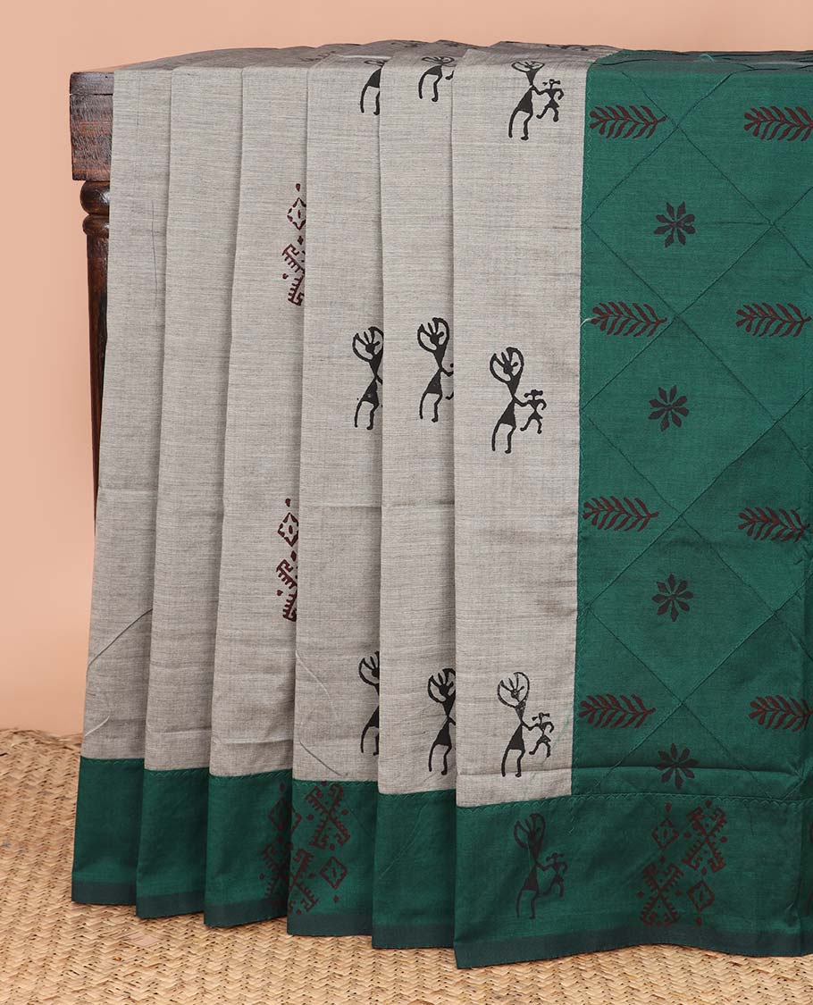 Grey warli motifs printed poly cotton saree, contrast warli motifs border, and buttas enclosed jaal pallu