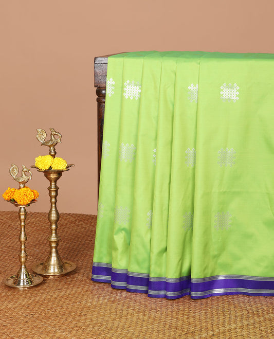 Green kolam design semi soft silk with zari double pet border & peacock design, rich pallu along with plain blouse