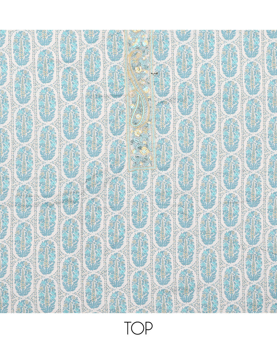 Blue material chudidar set, intricately printed with neck work top, plain bottom, and floral motifs embroidered dupatta
