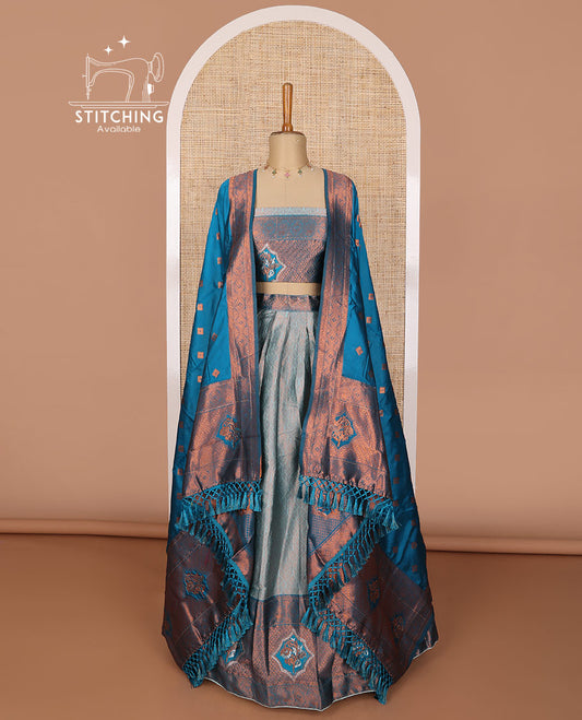 Blue jacquard tissue half saree with contrast floral zari design border, zari design blouse & floral design dhavani