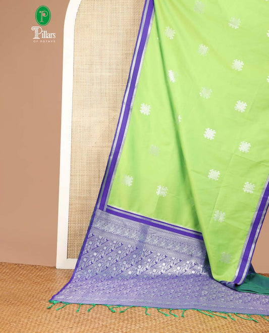 Green kolam design semi soft silk with zari double pet border & peacock design, rich pallu along with plain blouse