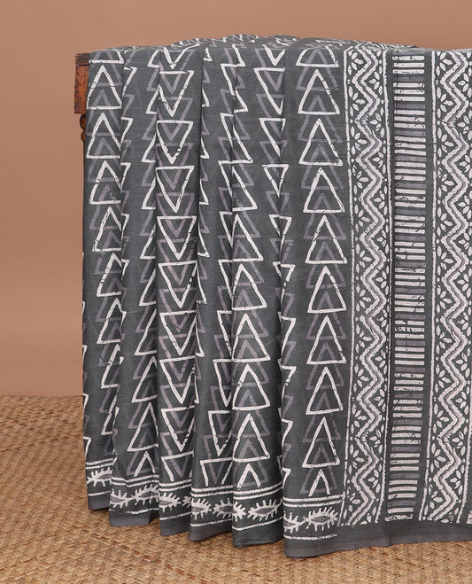 Grey batik-style triangle motifs mul mul cotton saree, batik-style printed border & floral-geometric printed pallu