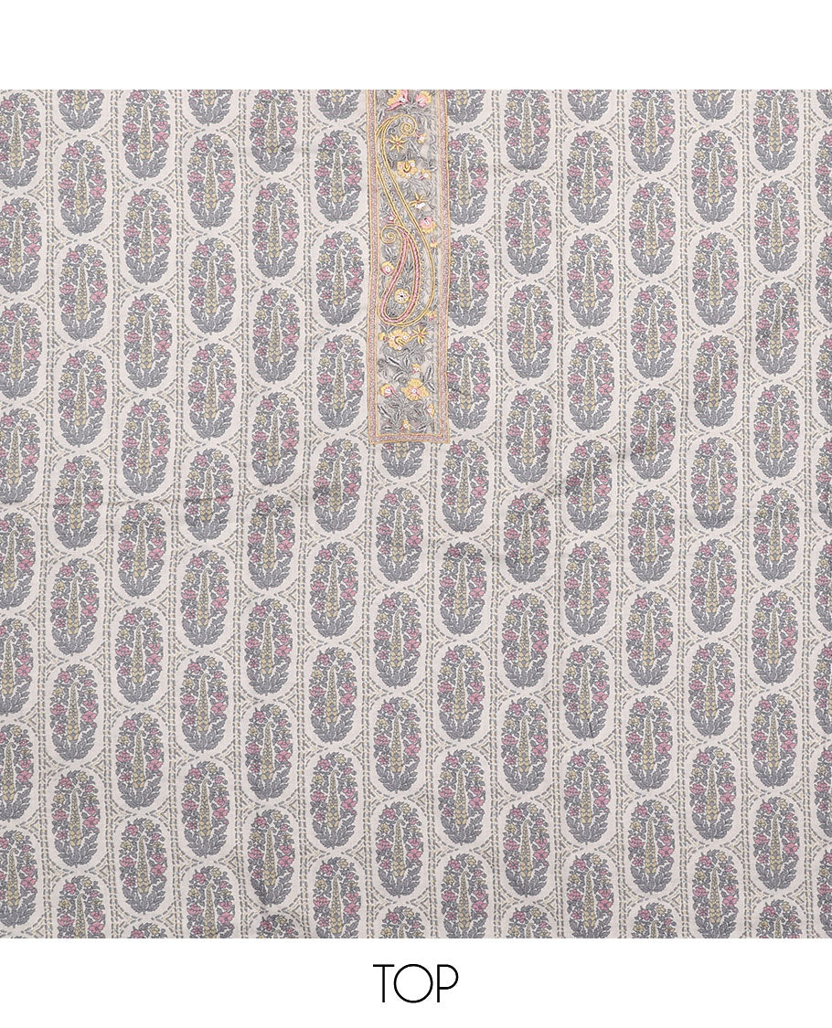 Pink material chudidar set, intricately printed with neck work top, plain bottom, and floral motifs embroidered dupatta