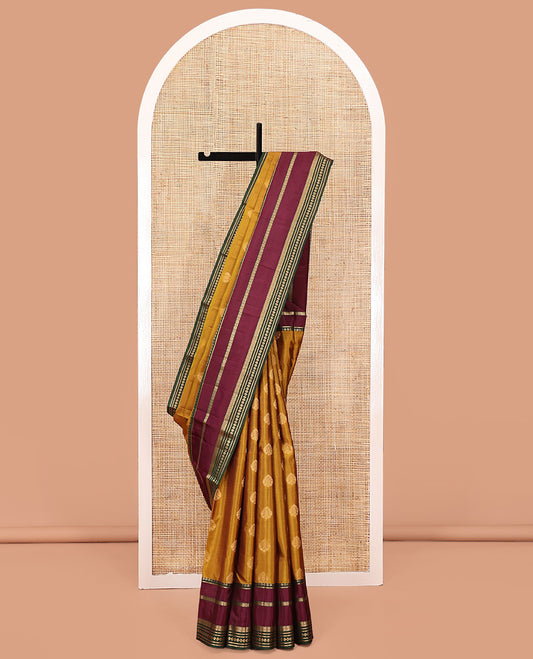 Mustard Vasundhara Lite Silk Saree, Subtly Sparkled With Zari Buttas All Over Its Body Complemented by Contrast Border of Traditional Zari Designs, Grand Pallu and Paired with a Contrast Blouse