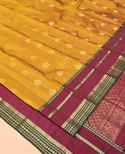 Mustard Vasundhara Lite Silk Saree, Subtly Sparkled With Zari Buttas All Over Its Body Complemented by Contrast Border of Traditional Zari Designs, Grand Pallu and Paired with a Contrast Blouse