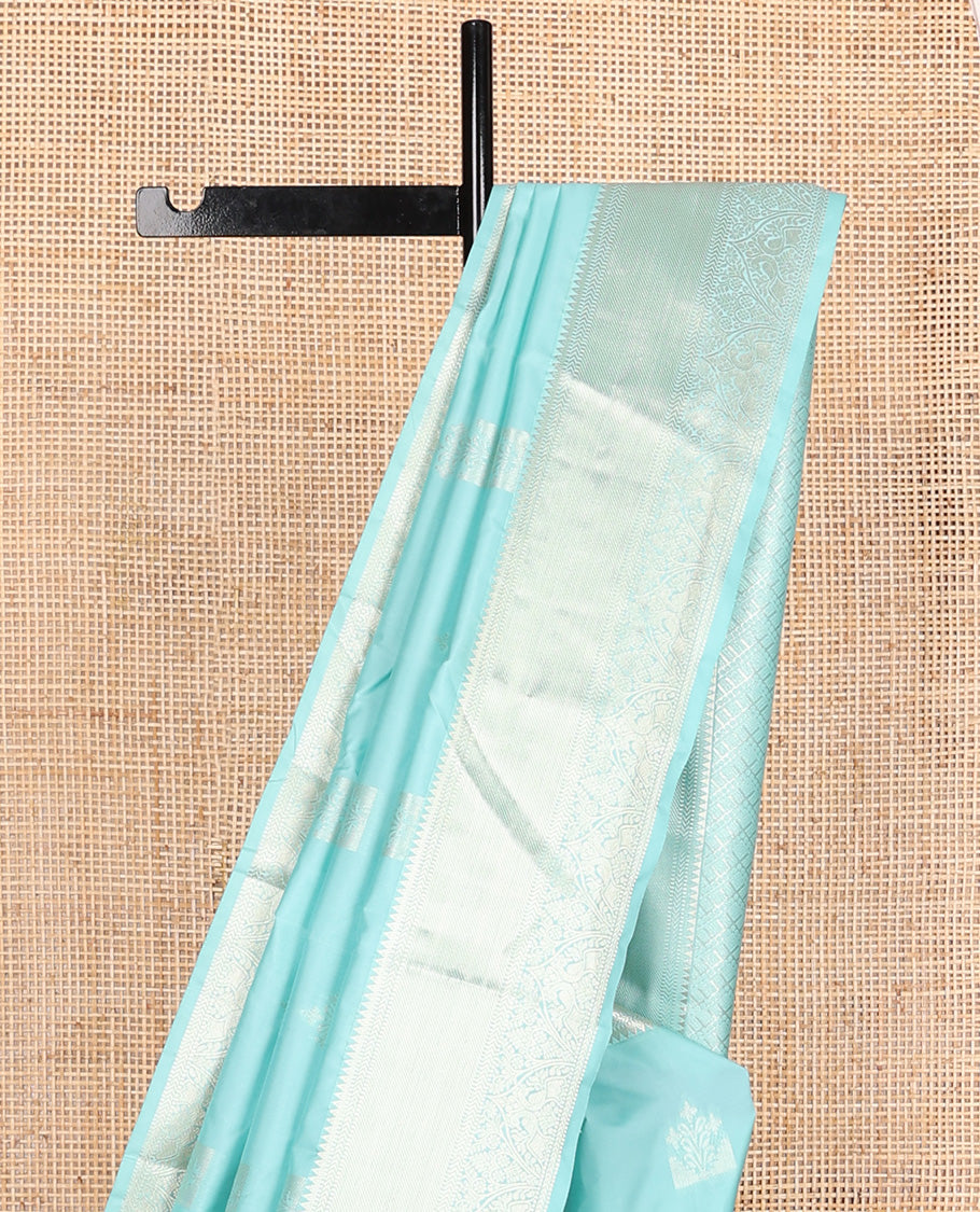 Blue zari buttas Vasundhara silk mix, zari border of rekku, muthu, kathir, mayil, and kodi visiry, and intricate pallu