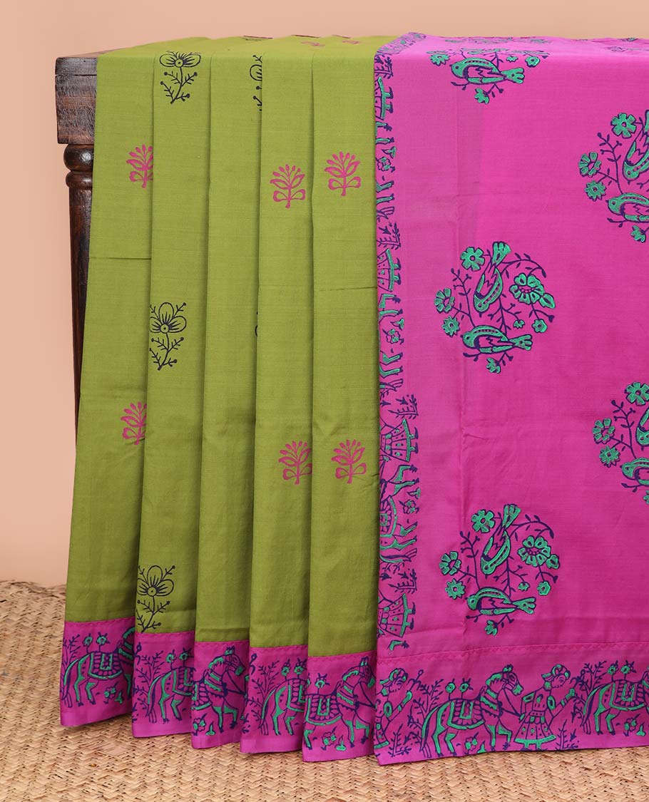 Parrot green floral motifs printed poly cotton saree, contrast horse-human motifs motifs border, and bird motif pallu