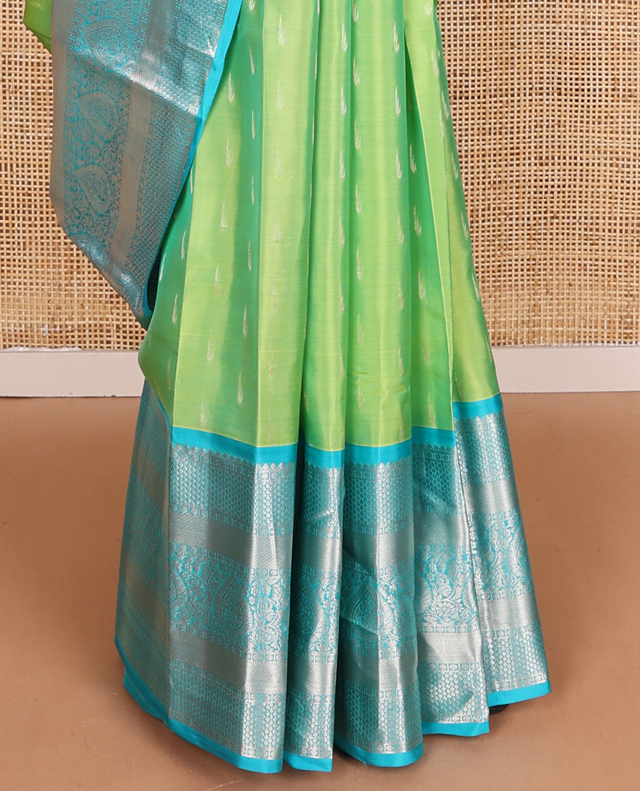 Parrot green muniya buttas Vasundhara silk mix, contrast border, and pallu of geometric zari designs
