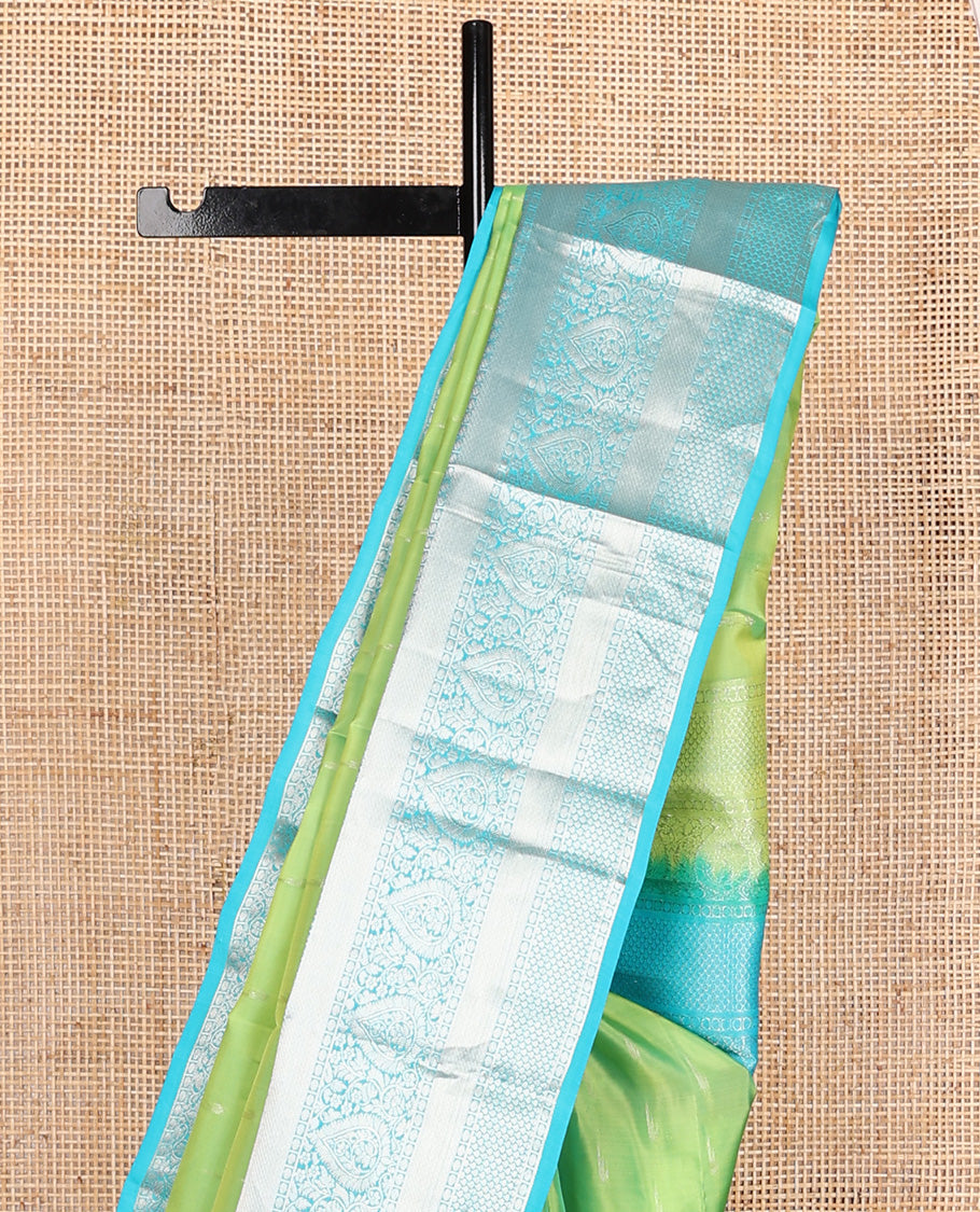 Parrot green muniya buttas Vasundhara silk mix, contrast border, and pallu of geometric zari designs