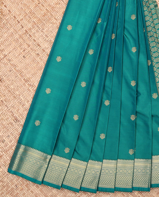 Green Budget Silk Saree, Ornamented with Zari Buttas, Highlighted by a Traditional Zari Border, Intricate Pallu, and a Matching Blouse