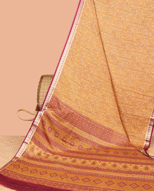 Orange intricately printed semi-banaras printed saree, contrast floral border & intricate pallu 
