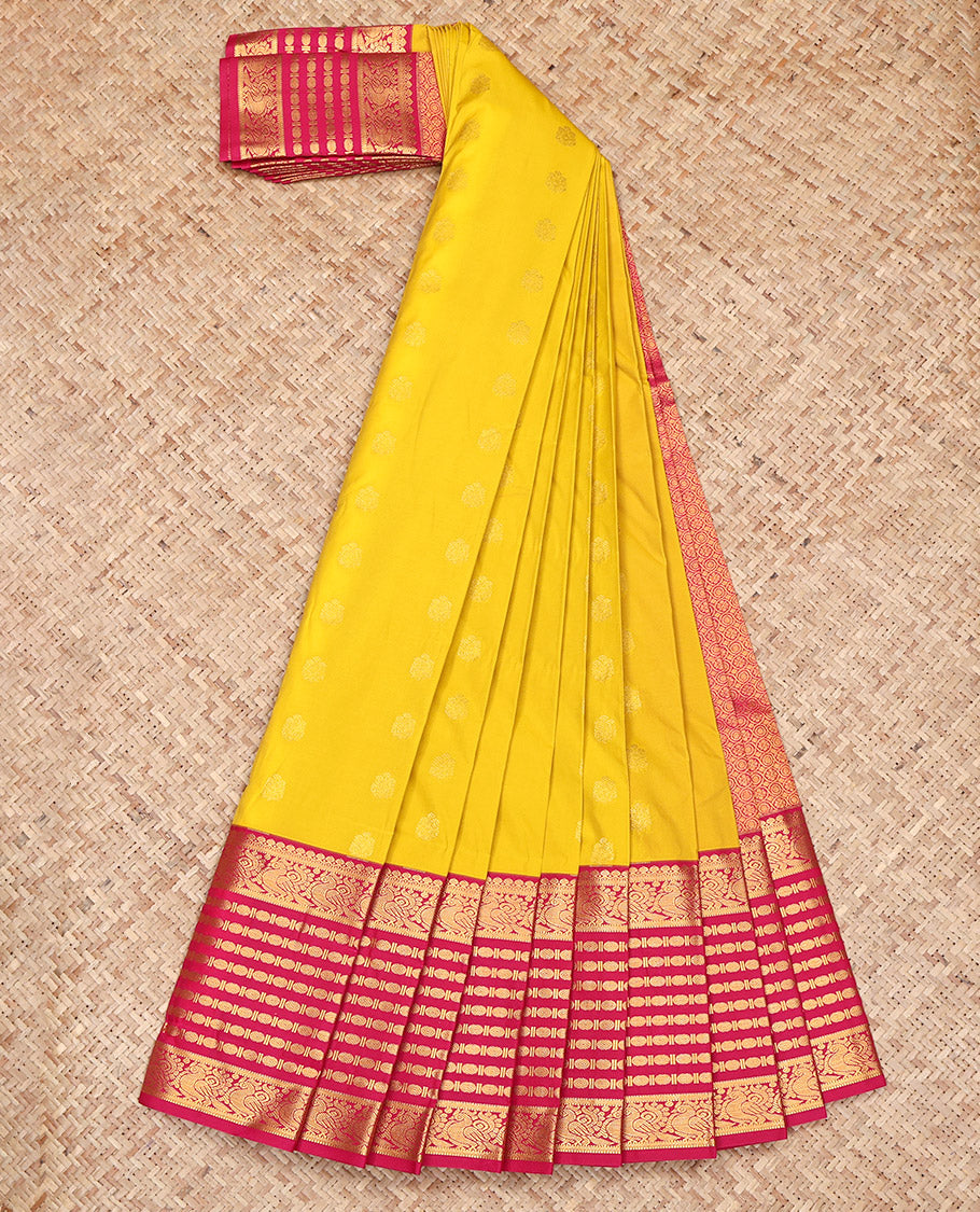 Yellow Budget Silk Saree, Sparsely Sparkled with Zari Buttas All Over Its Body, Complemented by Contrast Traditional Zari Border of Peacock and Rudrksham Designs, Grand Jaal-Patterned Pallu, and Paired with a Contrast Blouse