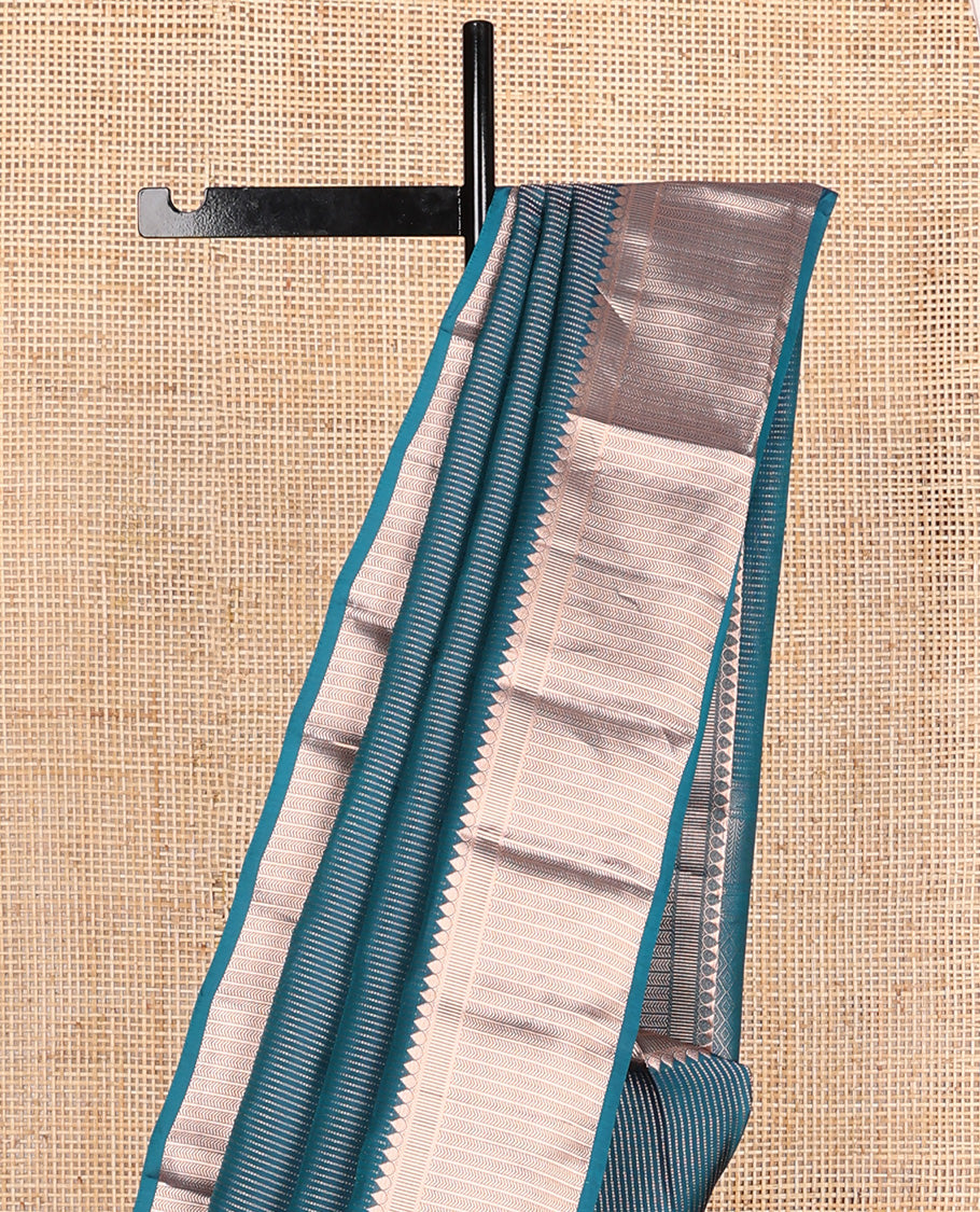 Blue muthu striped Vasundhara silk mix, zari border of thilakam, kathir, and banaras designs, and jaal pallu