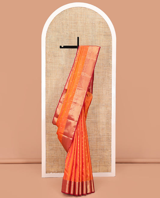 Orange Vasundhara Lite Silk Saree Subtly Sparkled With Zari Buttas All Over Its Body Complemented by Contrast Border of Mayil and Jaal Designs, Grand Jaal Pallu and Paired with a Contrast Blouse