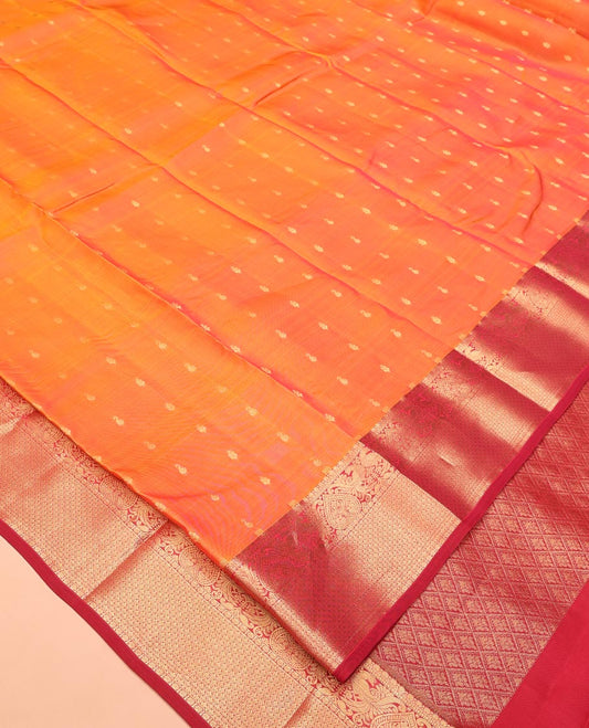 Orange Vasundhara Lite Silk Saree Subtly Sparkled With Zari Buttas All Over Its Body Complemented by Contrast Border of Mayil and Jaal Designs, Grand Jaal Pallu and Paired with a Contrast Blouse