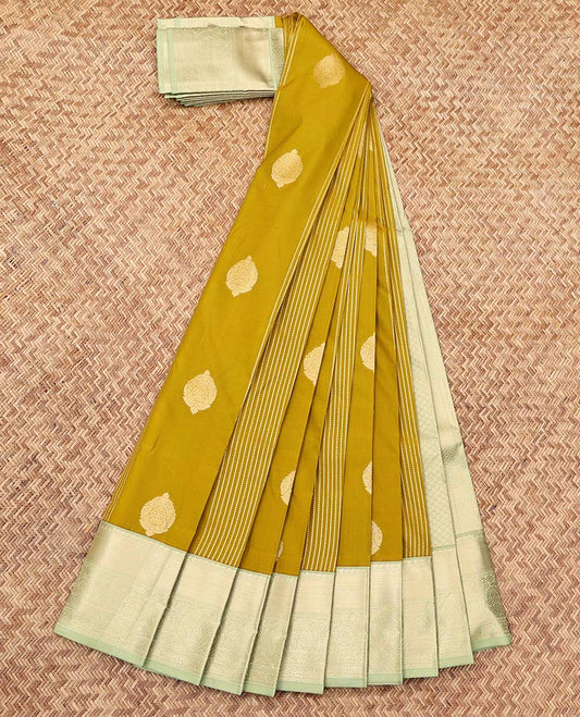 Green Budget Silk Saree, Gleamed Up with Zari Buttas and Stripes, a Contrast Traditional Zari Border, Grand Pallu, and a Contrast Blouse