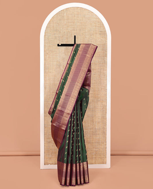 Green Vasundhara Lite Silk Saree Entralled with Zari Buttas All Over Its Body, Complemented by Contrast Border of Salngai, Poun, Kili, and Yaanai Designs, Grandly Decked Up Pallu and Paired with a Contrast Blouse