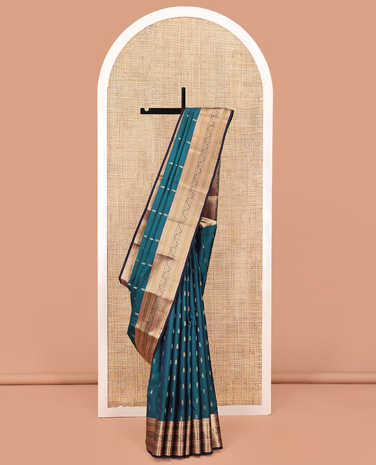 Blue Vasundhara Lite Silk Saree, Graced with Zari Buttas All Over Its Body, Complemented by Contrast Border of Mayil Kann and Dhavana Kodi Designs, Grand Jaal Pallu and Paired with a Contrast Blouse