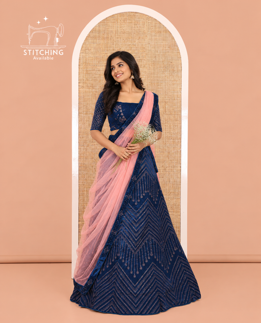 Blue Velvet Half-Saree, gleamed up with Swarovski Stonework Skirt, Matching Stonework Blouse, and Net Stonework Dhavani
