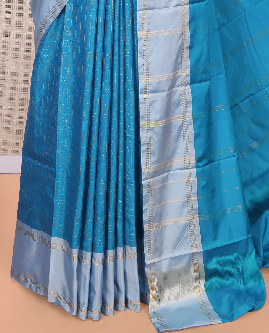 Blue Arani Saree, Features Zari Butta Enclosed Checks, a Contrast Bodi Border, Pallu of Zari Stripes, and a Matching Blouse