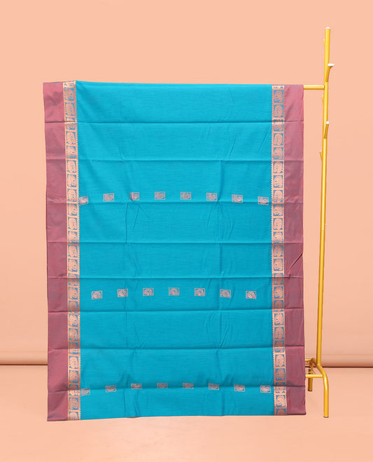 Blue Semi-Silk Cotton Saree, Decked Up with Zari Buttas All Over Its Body, Complemented by a Contrast Kal Eragina Border of Peacock Designs, Pallu Steeped with Elephant Zari Motifs, and Paired with a Matching Blouse