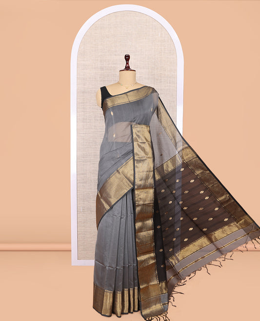 Grey Maheshwari Cotton Saree, Adorned with Buttas, Highlighted by a Traditional Zari Border, Pallu Gleamed Up with Zari Buttas, and a Contrast Blouse
